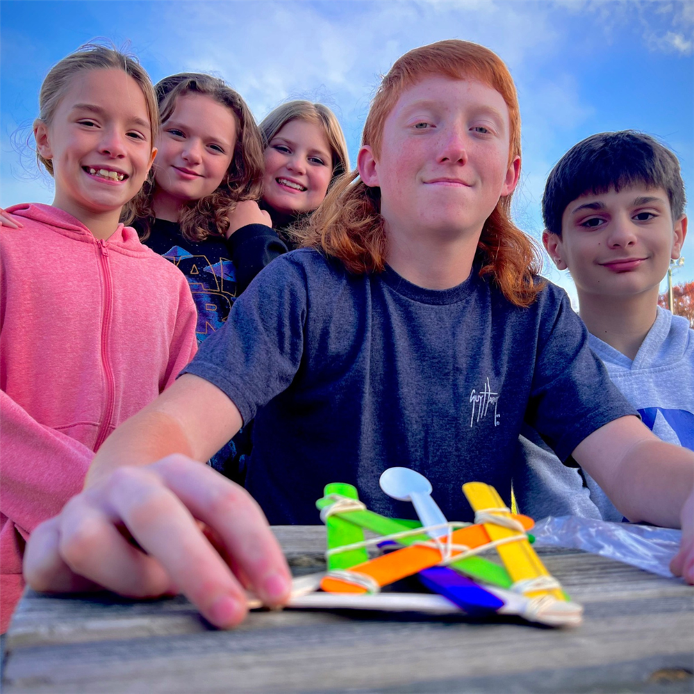 group of kids outside smiling