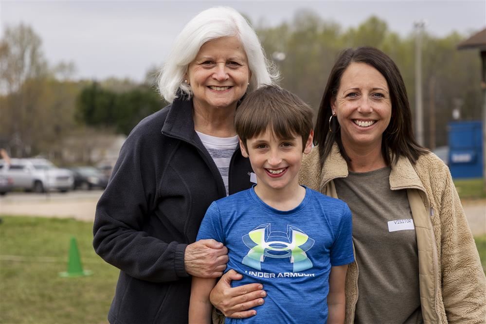 kid with grandparent and mom